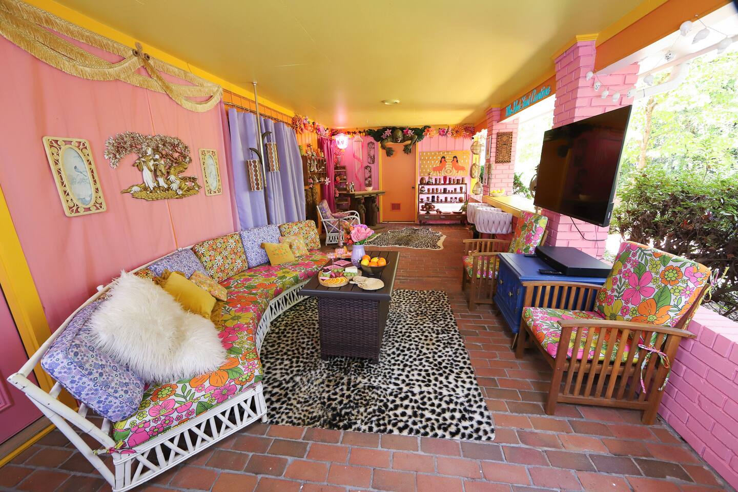 The Getaway Chalet tropical patio lounge with string lights